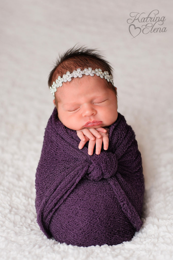 Newborn Girl Swaddled in Purple