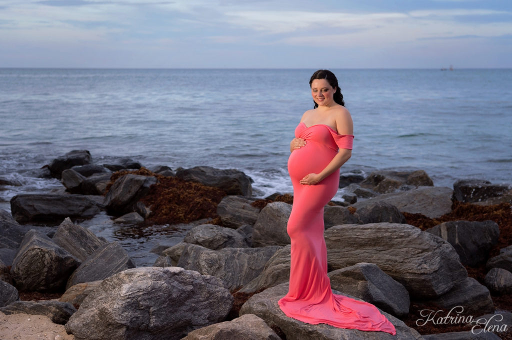 Portait Wearing a Coral Maternity Gown