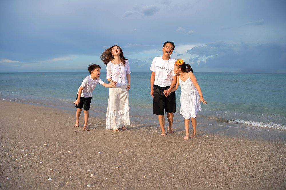 A funny and casual family portrait on the beach. A travel photoshoot while the family was on vacation in Singer Island, FL.